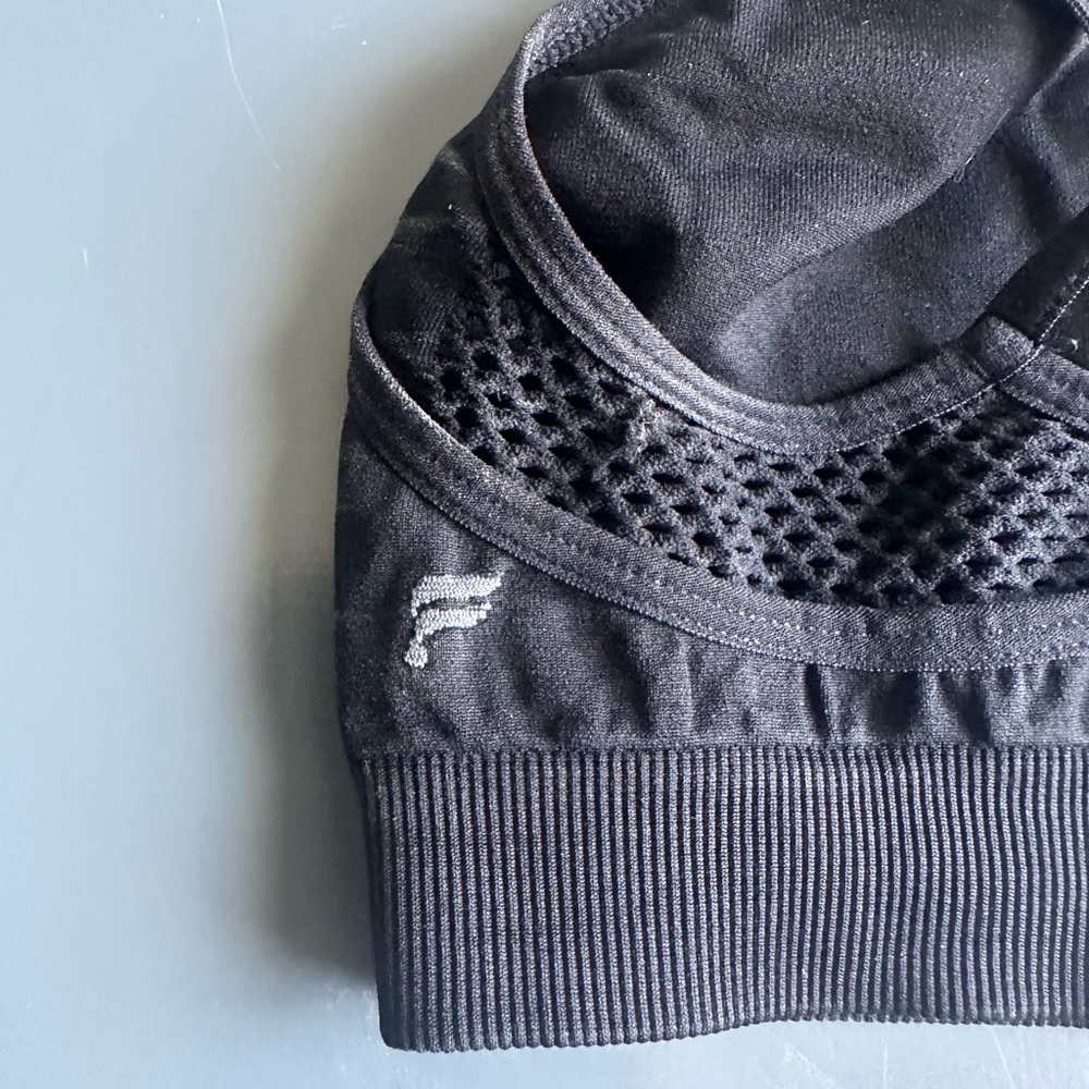 Fabletics, black layered sports bra, with cutout design.